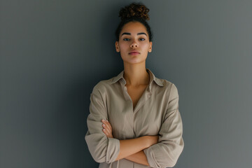 Wall Mural - pretty working woman with her arms folded standing