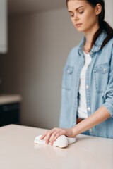 Wall Mural - Happy Caucasian Businesswoman Working on Laptop at Home, Smiling and Typing at Casual Table