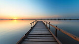 Fototapeta Pomosty - Dock overlooking a calm overcast lake background. Dock overlooking a calm overcast lake landscapes. Hdr landscape view. Old dock with sunset, candles, lamb, lake, sun and forest. high quality photos.