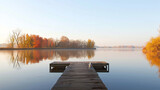 Fototapeta  - Dock overlooking a calm overcast lake background. Dock overlooking a calm overcast lake landscapes. Hdr landscape view. Old dock with sunset, candles, lamb, lake, sun and forest. high quality photos.