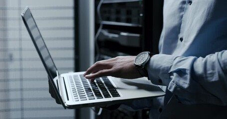 Leinwandbilder - Technician hands, data center and laptop for maintenance, system and hardware or software backup in cybersecurity. Person typing on computer for engineering, coding and programming in a server room