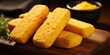 © Justlight - The vibrant yellow hue of the cornbread coating hints at the delightful explosion of flavors to follow, as you discover a perfectly seasoned sausage beneath the surface.
