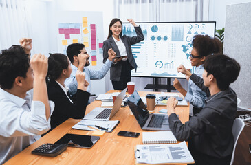 Wall Mural - Business people celebrate after successful presentation or meeting on data analysis display on TV screen. Happy team gathers in office room, cheer to collaboration with celebratory gesture. Concord