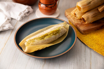 Wall Mural - Tamales. hispanic dish typical of Mexico and some Latin American countries. Corn dough wrapped in corn leaves. The tamales are steamed.