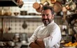 © piai - An Italian chef standing in his kitchen