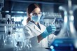 © Serhii - Female medical laboratory assistant in a protective mask and goggles in the laboratory conducts research