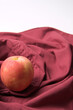 Apple on red cloth for cooking or baking.
