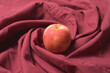 Apple on red cloth for cooking or baking.