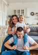 © Stanislava - Portrait of happy funny family with child in bright room