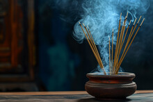 Burning Incense Sticks In A Stone Bowl