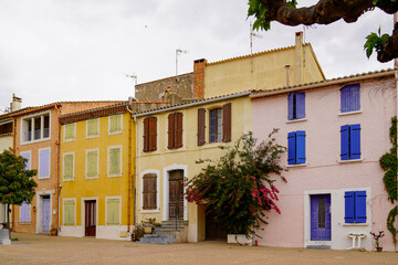 Wall Mural - Colourful house facade wall entrance fronts in Mediterranean seaside village of Leucate city Aude Department in south France