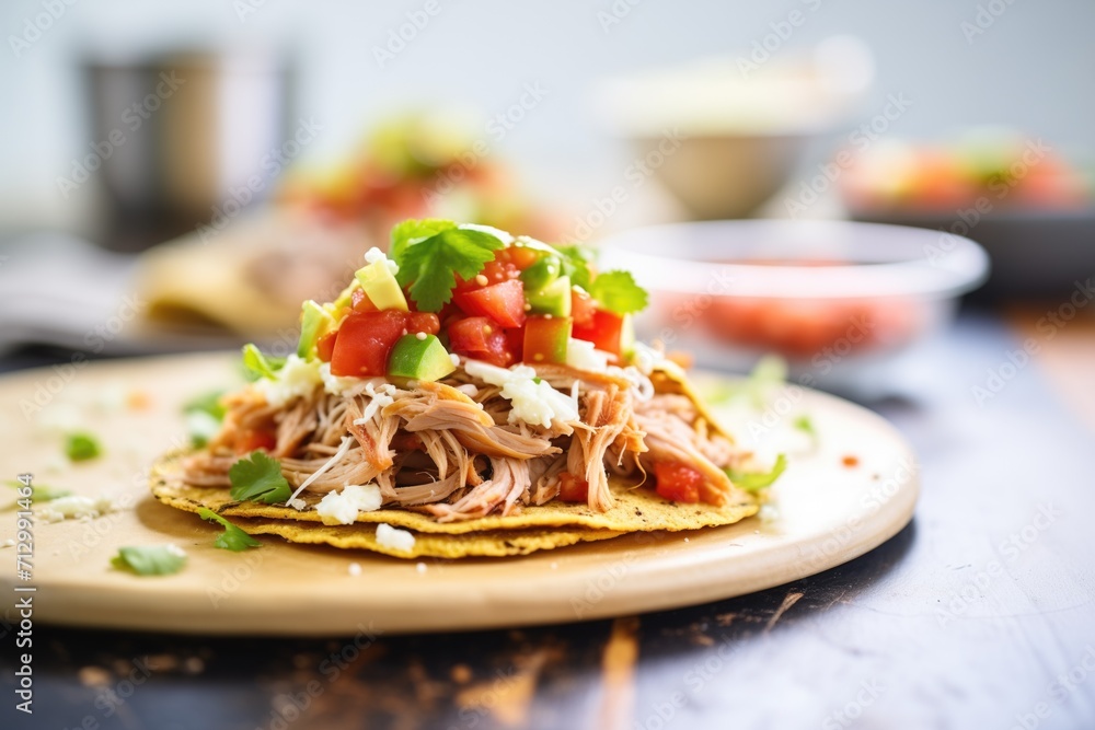 stack of tostadas with refried beans and shredded chicken Stock Photo ...