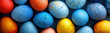 Colourful cracked eggs lying on the blue surface. Easter concept.