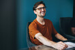 © Jacob Lund - Accomplished business man smiling and sitting in a meeting at work