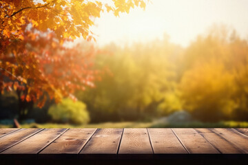 Empty blank wooden table fall background with autumn trees orange yellow color leaves backdrop forest or park nature scene abstract blurred bokeh tabletop for product display desk mockup. Copy space.