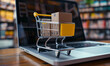 © IBEX.Media - Goods inside shopping cart on top of laptop keyboard