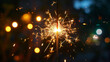 © RISHAD - Sparkler emitting glowing sparks.