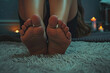 Womans Bare Feet Resting on Fluffy White Carpet