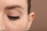 Fototapeta Panele - Woman with long eyelashes after mascara applying, closeup