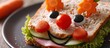 Fun food for kids cute smiling clown face on ham sandwich decorated with fresh cucumber carrots and tomatoes for a healthy lunch for children Creative cooking idea. Copy space image