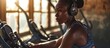 Fit African woman working out on a digital exercise bike engaging in cardio to maintain her health and wellbeing Woman using smart exercise equipment in her home fitness routine. Copy space image