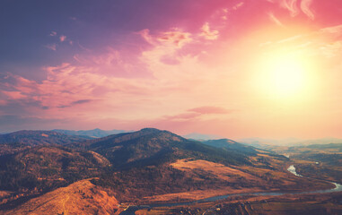 Wall Mural - Top view of colorful mountain slopes and river Stryi at sunset. Beautiful landscape. Carpathians, Carpathian Ruthenia, Ukraine