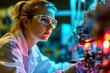 Woman engineer in protective glasses works in aerospace technical department. Young woman succeeds in company conducting aerospace engineering