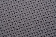 Struktura jasno szara tkanina z dziurkami w zbliżeniu makro