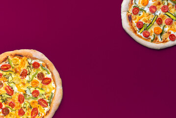 Wall Mural - Homemade vegetarian pizza isolated on a magenta colored background