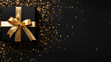 Fototapeta Kosmos - Stylish Black Giftbox with Golden Ribbon and Sequins, Top View on Isolated Background - Luxury Present for Special Occasions and Celebrations