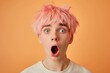 Startled Young Person with Pink Hair on Orange Background