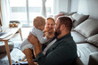 © Davor - Happy family with baby enjoying time together at home