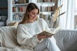a young happy female adult model, plain white crewneck sweater, sitting on a couch, reading a book, mockup photo --ar 3:2 --style raw --v 6 Job ID: ec4880f3-0852-4216-9f7d-0e93e140439d