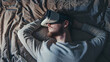 © MadSwordfish - Photograph of one man sleeping in bed wearing a VR headset.