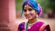 A beautiful portrait of a happy Indian girl in a traditional Hindu sari in the color of Holi. Silver jewelry of an Indian woman with powder paint on her dress, bright pink and blue hair
