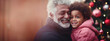 gray haired Caucasian grandfather with a beard hugs his African American grandson against the background of Christmas tree with balls for Christmas and New Year,diverse ethnic families,Generated AI