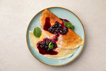 Wall Mural - Portion of sweet crepe blini pancakes with jam and berries