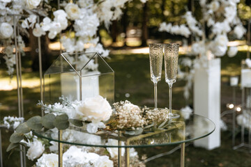 Wedding decor for the ceremony. A glass box and glasses to celebrate the painting