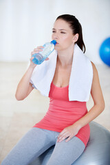 Poster - Ball, portrait or woman drinking water on break after exercise, workout or fitness training in gym. Fatigue, tired lady or thirsty sports athlete with liquid bottle for wellness, rest or hydration