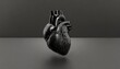 A 3D illustration of an anatomical human heart in black, with a detailed and realistic depiction, against a gray background.