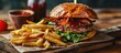 A delicious pub style bacon cheeseburger with barbecue sauce and french fries. Copy space image. Place for adding text or design