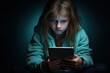 Mobile addiction and digital dependence concept at kids. Girl holds tablet. Copy space for design. Generation alpha