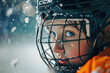 A young boy is pictured wearing a hockey helmet on top of an ice rink. This image can be used to depict ice hockey activities or as a representation of winter sports