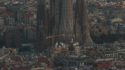 Wall Mural - Aerial view of Barcelona City Skyline and Sagrada Familia Cathedral at sunset. Residential famous urban grid of Catalonia. Beautiful panorama of Barcelona.