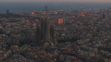 Wall Mural - Aerial view of Barcelona City Skyline and Sagrada Familia Cathedral at sunset. Residential famous urban grid of Catalonia. Beautiful panorama of Barcelona.