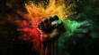 Black History Month background. Black power hand fist over red yellow green colors powder explosion.