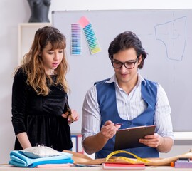 Wall Mural - Young tailors working in workshop