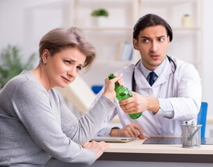 Poster - Female alcoholic visiting young male doctor