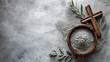 © LiliGraphie - Cross, ashes, and olive leaves on concrete stone background. Ash Wednesday concept
