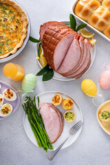 Wall Mural - Easter brunch table with a potion of ham with asparagus on the plate